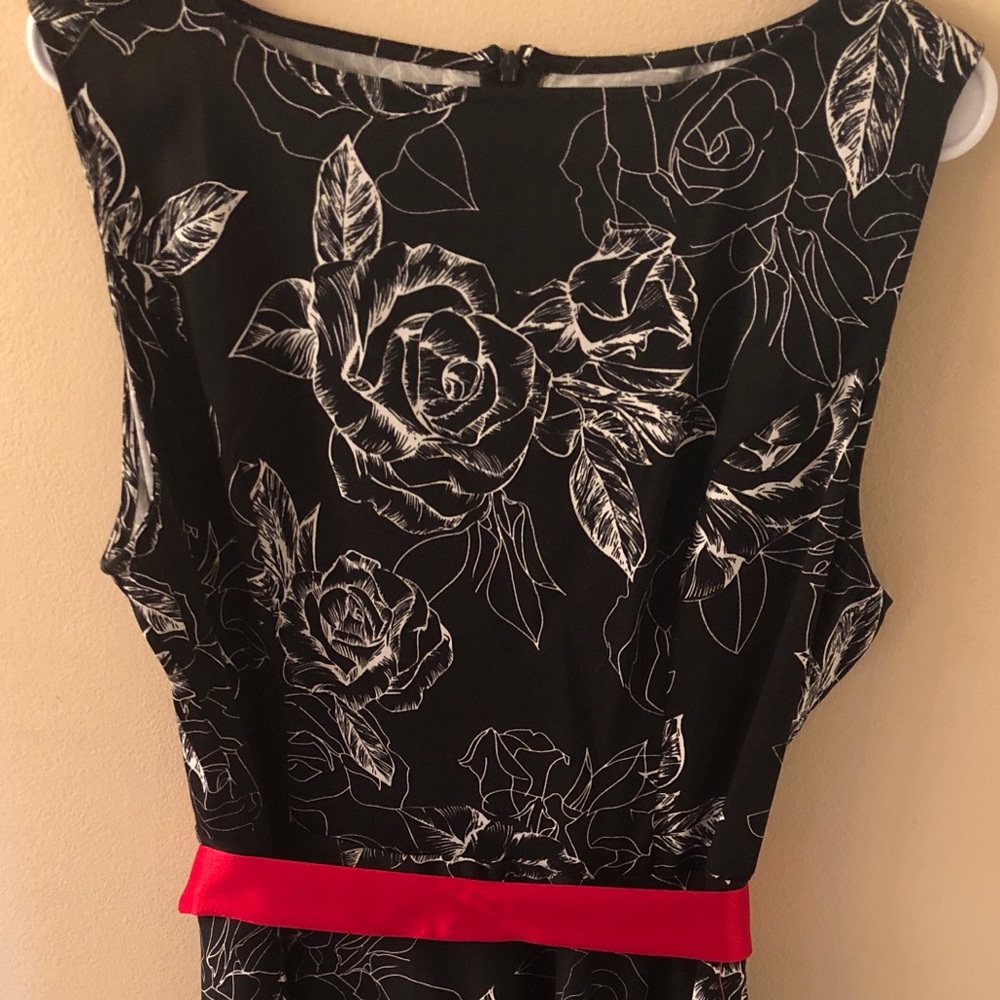 Black dress w/white accent flowers and red sash